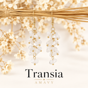 Boucles d’oreilles Transia en cristal de roche et acier inoxydable sur fond ivoire